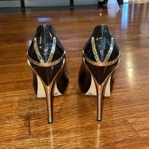 Vince Camuto black patent leather heels with gold heel design